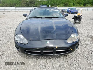 1999 Jaguar XK z VIN SAJGX2044XC031383, wystawiony jako Copart lot #54726925 z przebiegiem 107 696 mil mil oraz Szkody całkowita. Historia ofert i sprzedaży dostępna na DreamBid. Obrazek 5.