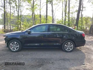 2015 Volkswagen Jetta SE z VIN 3VWD07AJ1FM277499, wystawiony jako IAAI lot #42085122 z przebiegiem 122 754 mil mil oraz . Historia ofert i sprzedaży dostępna na DreamBid. Obrazek 14.
