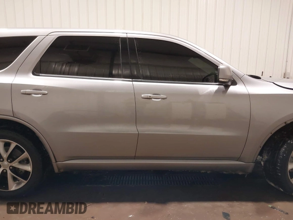 2014 Dodge Durango R/T with VIN 1C4SDJCTXEC558937, listed as a IAAI auction lot 41570244 with 174,724 mi miles and . Bid and sale history available at DreamBid. Image 14.