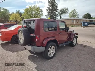 2008 Jeep Wrangler Sahara with VIN 1J4FA54118L537472, listed as a Copart auction lot 57785185 with 121,029 mi miles and Clean title. Bid and sale history available at DreamBid. Image 4.