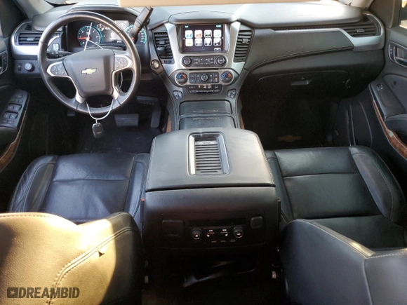 2017 Chevrolet Suburban Premier with VIN 1GNSKJKC5HR303600, listed as a Copart auction lot 83395644 with 124,465 mi miles and Salvage Title. Bid and sale history available at carsss.com. Image 8.