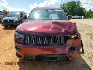 2017 Jeep Grand Cherokee Altitude with VIN 1C4RJEAG9HC702924, listed as a Copart auction lot 57897805 with 133,796 mi miles and Salvage title. Bid and sale history available at DreamBid. Image 5.