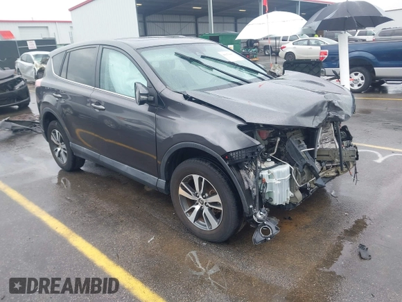 2018 Toyota RAV4 XLE with VIN 2T3RFREV5JW701564, listed as a IAAI auction lot 41976067 with 128,404 mi miles. Bid and sale history available at carsss.com. Image 1.
