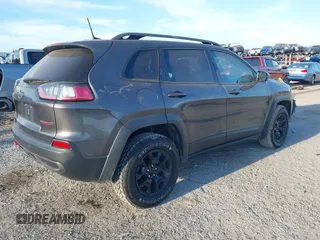 2019 Jeep Cherokee Trailhawk with VIN 1C4PJMBX3KD246100, listed as a IAAI auction lot 41191581 with 98,124 mi miles and . Bid and sale history available at DreamBid. Image 4.