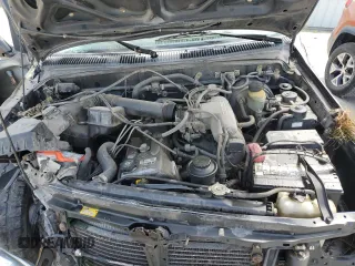 1996 Toyota Tacoma z VIN 4TAWM72N5TZ191278, wystawiony jako Copart lot #57338965 z przebiegiem 233 749 mil mil oraz Szkoda całkowita • Salvage title. Historia ofert i sprzedaży dostępna na DreamBid. Obrazek 11.