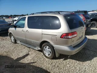 2002 Toyota Sienna LE with VIN 4T3ZF13C62U495093, listed as a Copart auction lot 73634214 with 61,290 mi miles and Salvage Title. Bid and sale history available at carsss.com. Image 2.
