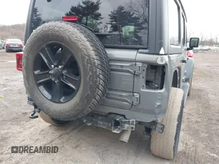 2021 Jeep Wrangler Unlimited Sport Altitude with VIN 1C4HJXDG1MW603784, listed as a IAAI auction lot 41509231 with 102,567 mi miles and . Bid and sale history available at DreamBid. Image 20.