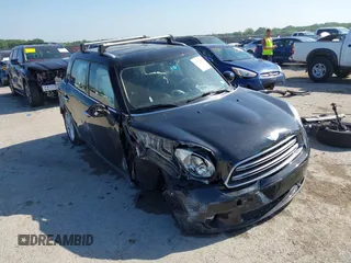 2015 MINI Countryman with VIN WMWZB3C54FWM33074, listed as a IAAI auction lot 42094992 with 86,704 mi miles and . Bid and sale history available at DreamBid. Image 1.