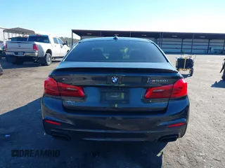 2018 BMW 5 Series M550i xDrive with VIN WBAJB9C57JG463933, listed as a IAAI auction lot 41295711 with 99,173 mi miles and . Bid and sale history available at carsss.com. Image 16.