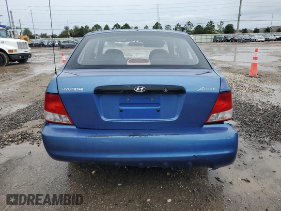 2001 Hyundai Accent z VIN KMHCF35G11U112976, wystawiony jako Copart lot #68692384 z przebiegiem 152 797 mil mil oraz Szkoda całkowita • Salvage title. Historia ofert i sprzedaży dostępna na DreamBid. Obrazek 6.