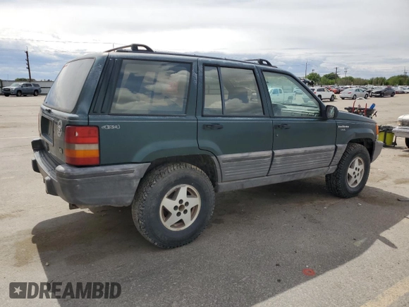 1993 Jeep Grand Cherokee Laredo with VIN 1J4GZ58Y8PC513026, listed as a Copart auction lot 57001465 with 135,242 mi miles and Clean title. Bid and sale history available at DreamBid. Image 3.