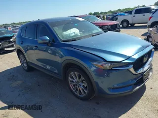 2019 Mazda CX-5 Grand Touring with VIN JM3KFADMXK1514579, listed as a IAAI auction lot 42310223 with 79,962 mi miles and . Bid and sale history available at DreamBid. Image 1.