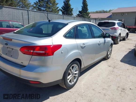 2017 Ford Focus SE z VIN 1FADP3F21HL237412, wystawiony jako IAAI lot #42188886 z przebiegiem 148 355 mil mil oraz . Historia ofert i sprzedaży dostępna na DreamBid. Obrazek 4.