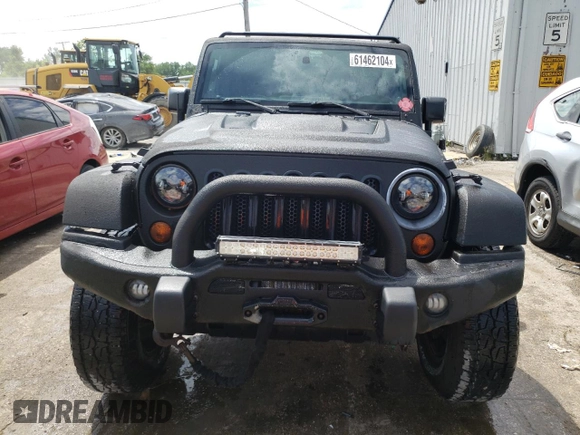 2013 Jeep Wrangler Unlimited Rubicon 10th Anniversary with VIN 1C4HJWFGXDL543660, listed as a Copart auction lot 61462104 with 115,897 mi miles and Salvage title. Bid and sale history available at DreamBid. Image 5.