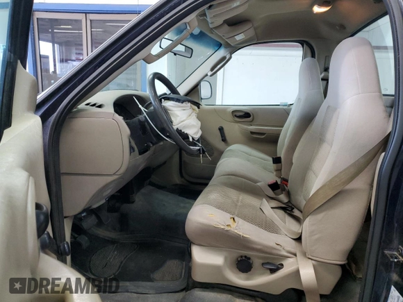 2003 Ford F-150 XL with VIN 1FTRF17293NA60031, listed as a Copart auction lot 55433885 with 186,557 mi miles and Salvage title. Bid and sale history available at DreamBid. Image 7.