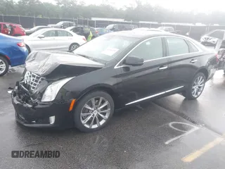 2013 Cadillac XTS Premium z VIN 2G61S5S39D9112491, wystawiony jako IAAI lot #42216373 z przebiegiem 145 338 mil mil oraz . Historia ofert i sprzedaży dostępna na DreamBid. Obrazek 2.
