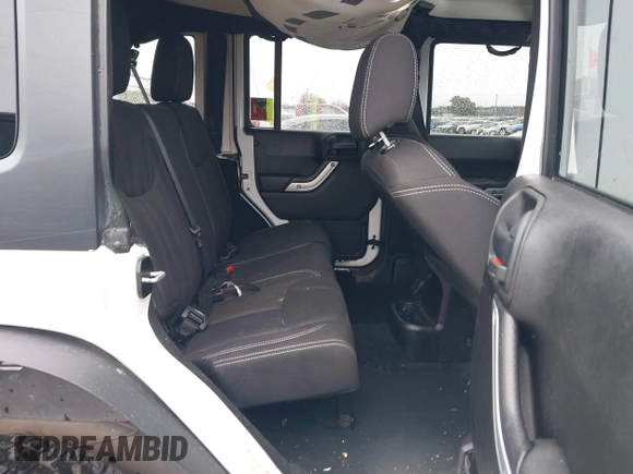 2014 Jeep Wrangler Unlimited Rubicon with VIN 1C4BJWFGXEL283929, listed as a IAAI auction lot 41812052 with 137,790 mi miles and . Bid and sale history available at DreamBid. Image 8.