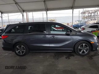 2019 Honda Odyssey Touring z VIN 5FNRL6H88KB037149, wystawiony jako IAAI lot #42356871 z przebiegiem 64 549 mil mil oraz . Historia ofert i sprzedaży dostępna na DreamBid. Obrazek 13.