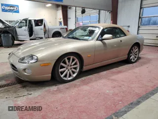 2005 Jaguar XK with VIN SAJDA42CX52A43323, listed as a Copart auction lot 84439154 with 98,389 mi miles and Salvage Title. Bid and sale history available at carsss.com. Image 1.