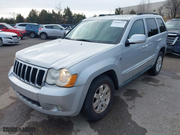 2009 Jeep Grand Cherokee Limited with VIN 1J8HR58P99C538725, listed as a IAAI auction lot 41466122 with 220,803 mi miles. Bid and sale history available at carsss.com. Image 2.