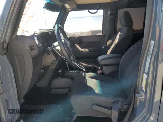 2015 Jeep Wrangler Unlimited Sahara with VIN 1C4BJWEGXFL624846, listed as a Copart auction lot 47949535 with 125,710 mi miles and Salvage Title. Bid and sale history available at carsss.com. Image 7.