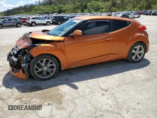 2013 Hyundai Veloster w/Black Int z VIN KMHTC6AD4DU145464, wystawiony jako Copart lot #53065595 z przebiegiem 158 620 mil mil oraz Szkoda całkowita • Salvage title. Historia ofert i sprzedaży dostępna na DreamBid. Obrazek 1.