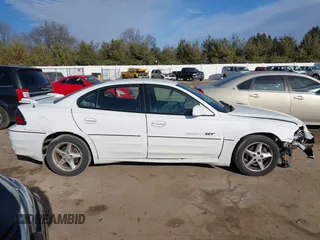 2001 Pontiac Grand Am GT with VIN 1G2NW52E11C244447, listed as a IAAI auction lot 41697883 with 81,983 mi miles. Bid and sale history available at carsss.com. Image 13.