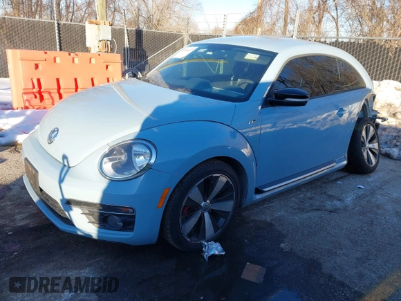 2014 Volkswagen Beetle Turbo R-Line with VIN 3VWVT7AT9EM661347, listed as a IAAI auction lot 41336295 with 61,068 mi miles and . Bid and sale history available at DreamBid. Image 2.