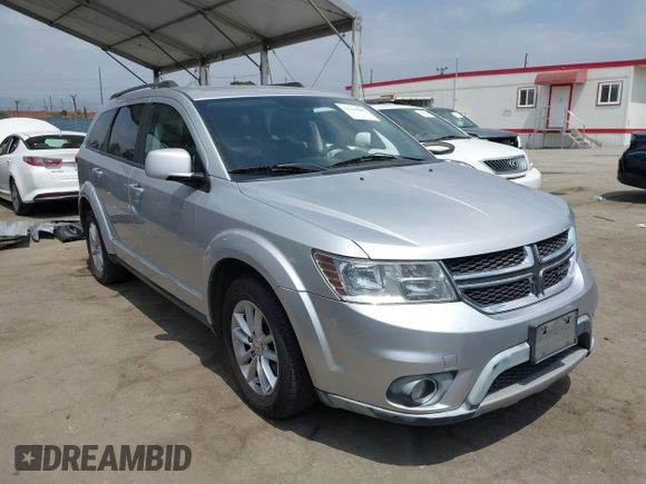2013 Dodge Journey SXT with VIN 3C4PDCBG9DT506384, listed as a IAAI auction lot 42119685 with 143,769 mi miles. Bid and sale history available at carsss.com. Image 1.