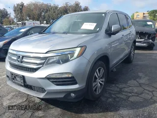 2016 Honda Pilot EX-L with VIN 5FNYF5H57GB038349, listed as a IAAI auction lot 41378569 with 117,651 mi miles and . Bid and sale history available at DreamBid. Image 17.