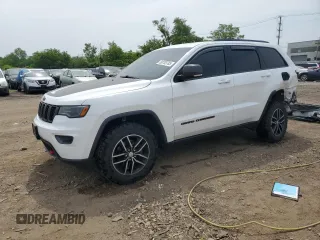 2018 Jeep Grand Cherokee Trailhawk with VIN 1C4RJFLG8JC361329, listed as a Copart auction lot 60783785 with 124,229 mi miles and Salvage title. Bid and sale history available at DreamBid. Image 1.