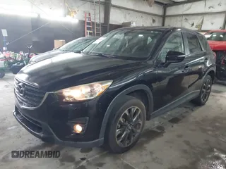 2016 Mazda CX-5 Grand Touring with VIN JM3KE4DY5G0816575, listed as a IAAI auction lot 42101340 with 180,762 mi miles and . Bid and sale history available at carsss.com. Image 19.