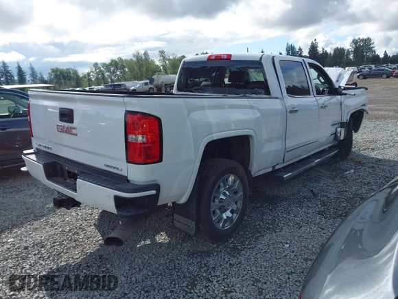 2019 GMC Sierra 2500HD Denali z VIN 1GT12SEY3KF269442, wystawiony jako IAAI lot #42231991 z przebiegiem 75 172 mil mil oraz . Historia ofert i sprzedaży dostępna na DreamBid. Obrazek 4.