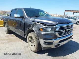 2020 Ram 1500 Laramie with VIN 1C6SRFJT7LN322837, listed as a IAAI auction lot 42472602 with 64,032 mi miles and . Bid and sale history available at DreamBid. Image 1.