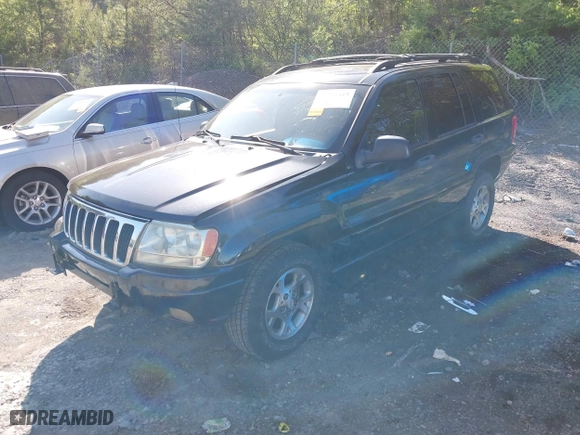 1999 Jeep Grand Cherokee Laredo with VIN 1J4GW58S5XC687480, listed as a IAAI auction lot 42016415 with 186,776 mi miles. Bid and sale history available at carsss.com. Image 2.