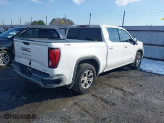 2021 GMC Sierra 1500 SLE with VIN 3GTU9BED5MG183086, listed as a IAAI auction lot 41313798 with 125,259 mi miles. Bid and sale history available at carsss.com. Image 4.