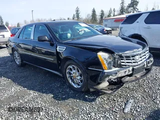 2006 Cadillac DTS 1SC z VIN 1G6KD57YX6U100634, wystawiony jako IAAI lot #41671007 z przebiegiem Nie podano mil oraz . Historia ofert i sprzedaży dostępna na DreamBid. Obrazek 1.