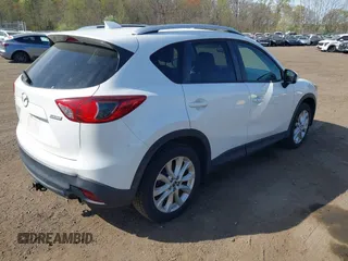 2013 Mazda CX-5 Grand Touring with VIN JM3KE4DE3D0156957, listed as a IAAI auction lot 42085443 with 146,990 mi miles. Bid and sale history available at carsss.com. Image 4.