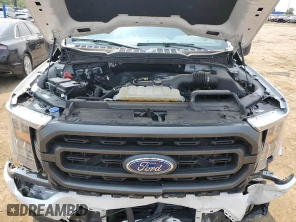 2023 Ford F-150 XL with VIN 1FTEW1EP7PFB66555, listed as a Copart auction lot 59384665 with 28,495 mi miles and Salvage title. Bid and sale history available at DreamBid. Image 11.