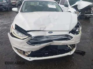 2018 Ford Fusion SE z VIN 3FA6P0H75JR159448, wystawiony jako IAAI lot #42262839 z przebiegiem 144 353 mil mil oraz . Historia ofert i sprzedaży dostępna na DreamBid. Obrazek 6.
