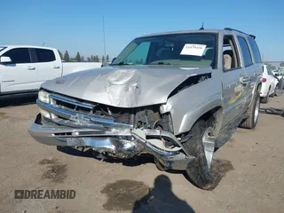 2004 Chevrolet Tahoe LS with VIN 1GNEC13T64J282970, listed as a IAAI auction lot 41879458 with 205,952 mi miles and . Bid and sale history available at DreamBid. Image 2.