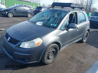 2012 Suzuki SX4 Crossover with VIN JS2YB5A34C6303762, listed as a IAAI auction lot 41840102 with 118,325 mi miles and . Bid and sale history available at carsss.com. Image 2.