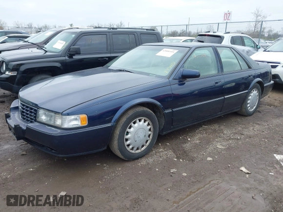 1993 Cadillac Seville Touring STS z VIN 1G6KY5297PU804313, wystawiony jako IAAI lot #42001104 z przebiegiem 242 756 mil mil oraz . Historia ofert i sprzedaży dostępna na DreamBid. Obrazek 2.