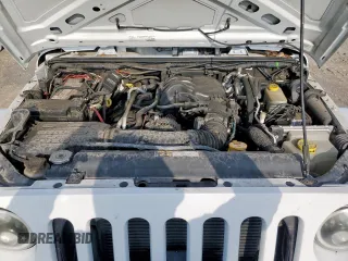 2015 Jeep Wrangler Unlimited Sport with VIN 1C4BJWDG9FL759012, listed as a Copart auction lot 61002465 with 101,395 mi miles and Salvage title. Bid and sale history available at DreamBid. Image 12.
