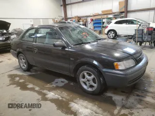 1999 Toyota Tercel z VIN JT2AC53LXX0390154, wystawiony jako Copart lot #83014424 z przebiegiem 182 579 mil mil oraz Szkoda całkowita • Salvage title. Historia ofert i sprzedaży dostępna na DreamBid. Obrazek 4.