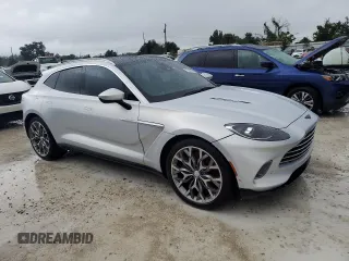 2021 Aston Martin DBX z VIN SCFVUJAW4MTV03930, wystawiony jako Copart lot #73946614 z przebiegiem Nie podano mil oraz Nie do naprawy. Historia ofert i sprzedaży dostępna na DreamBid. Obrazek 4.