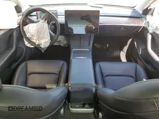 2023 Tesla Model 3 with VIN 5YJ3E1EA9PF558088, listed as a Copart auction lot 52228465 with 63,204 mi miles and Salvage title. Bid and sale history available at DreamBid. Image 8.