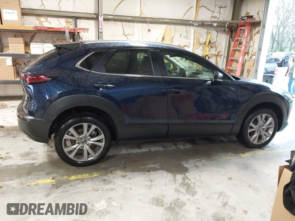 2022 Mazda CX-30 S Select z VIN 3MVDMBBL0NM440747, wystawiony jako IAAI lot #41864038 z przebiegiem 9667 mil mil oraz . Historia ofert i sprzedaży dostępna na DreamBid. Obrazek 13.