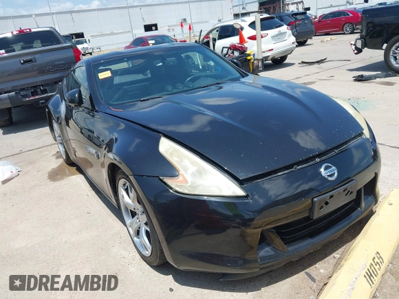 2012 Nissan 370Z z VIN JN1AZ4EH1CM564630, wystawiony jako IAAI lot #42177880 z przebiegiem 173 751 mil mil oraz . Historia ofert i sprzedaży dostępna na DreamBid. Obrazek 1.