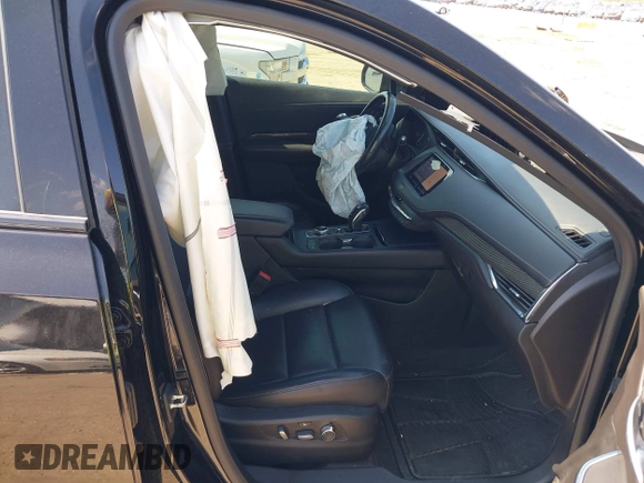 2019 Cadillac XT4 FWD Sport with VIN 1GYFZER46KF125100, listed as a IAAI auction lot 42221290 with 79,491 mi miles and . Bid and sale history available at DreamBid. Image 5.